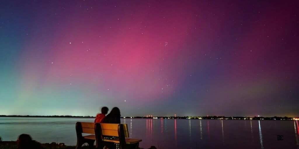 People watch the Northern Lights dance over the Detroit River 